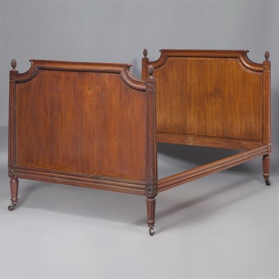 Lot 432 - Louis XVI Style Walnut Bedstead The arched...