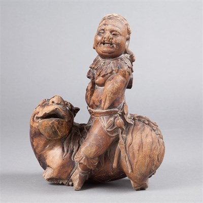 Lot 199 - Chinese Wood Carving of a Boy and Foo Lion...