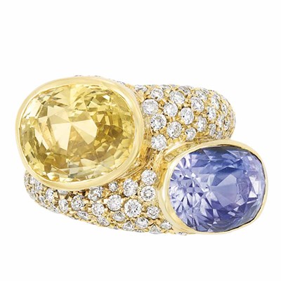 Lot 507 - Gold, Yellow Sapphire, Violetish-Blue Sapphire and Diamond Crossover Ring