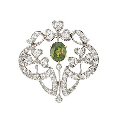 Lot 204 - Belle Epoque Platinum, Gold, Demantoid Garnet and Diamond Pendant-Brooch