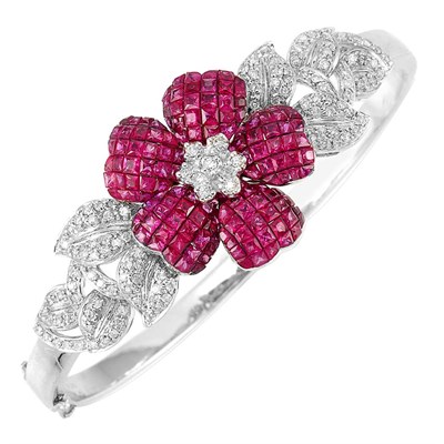 Lot 621 - White Gold, Invisibly-Set Ruby and Diamond Flower Bangle Bracelet