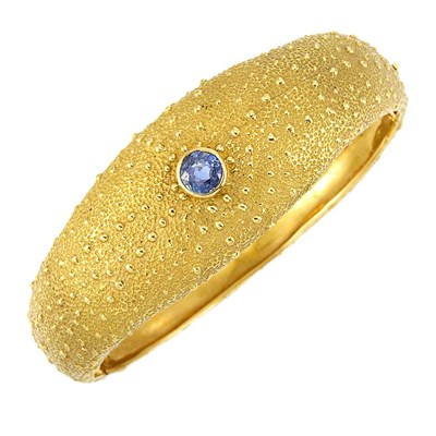 Lot 591 - Gold and Sapphire Bangle Bracelet