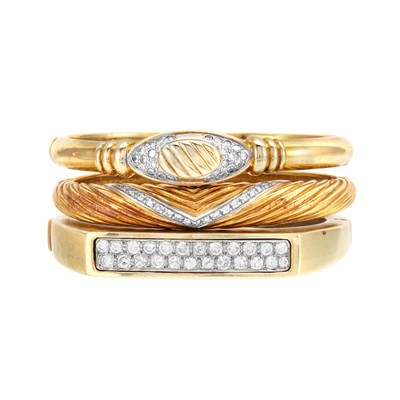 Lot 536 - Three Gold and Diamond Bangle Bracelets