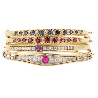 Lot 27 - Four Gold, Diamond and Gem-Set Bangle Bracelets