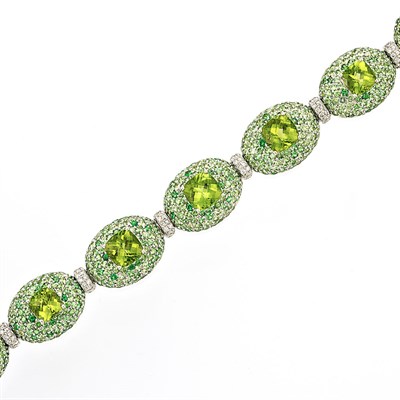 Lot 599 - White Gold, Peridot, Green Garnet and Diamond Bracelet