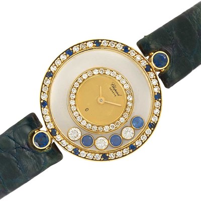 Lot 524 - Lady's Gold, Diamond and Sapphire 'Happy Diamonds' Wristwatch, Chopard