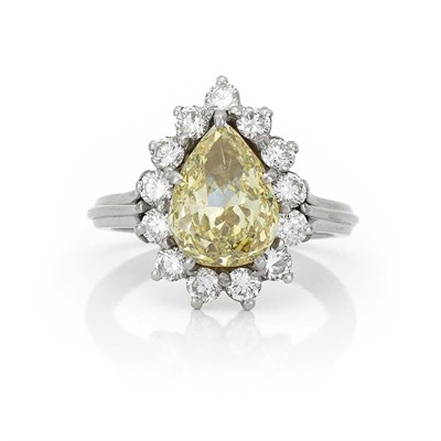 Lot 503 - Platinum, Fancy Yellow Diamond and Diamond Ring