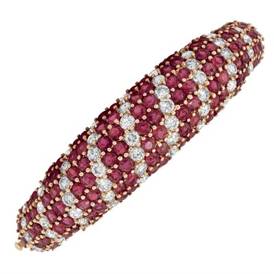 Lot 312 - Gold, Ruby and Diamond Bombe Bangle Bracelet