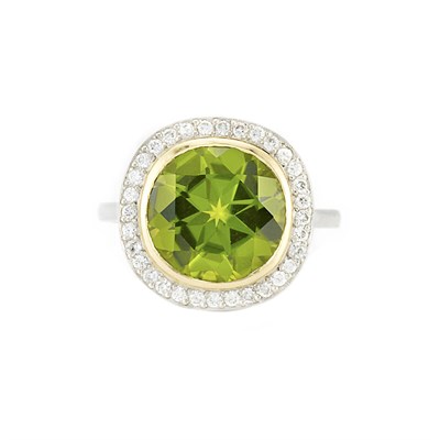 Lot 518 - Platinum, Gold, Peridot and Diamond Ring