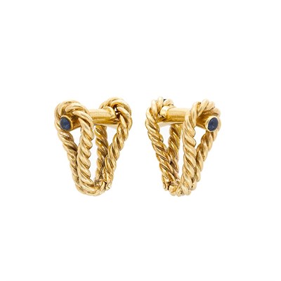 Lot 93 - Pair of Gold and Cabochon Sapphire Cufflinks, Tiffany & Co.
