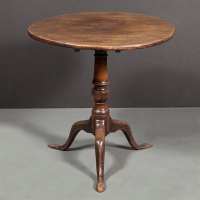 Lot 188 - George II Walnut Tilt-Top Table The circular...