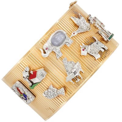 Lot 477 - Gold, Platinum, Diamond and Gem-Set Charm Cuff Bangle Bracelet