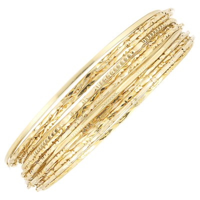 Lot 465 - Fourteen Gold Bangle Bracelets