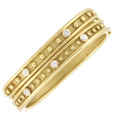 Lot 1 - Pair of Gold and Diamond Bangle Bracelets