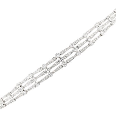 Lot 501 - Triple Strand White Gold and Diamond Bracelet