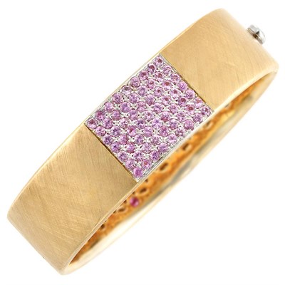 Lot 818 - Rose Gold and Pink Sapphire Bangle Bracelet