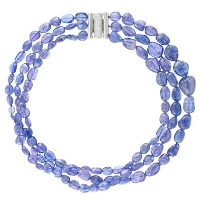 Lot 835 - Triple Strand Tumbled Tanzanite Bead Necklace with White Gold and Diamond Clasp