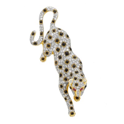 Lot 668 - Two-Color Gold, Diamond, Black Onyx and Cabochon Ruby Leopard Brooch