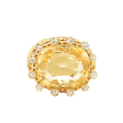 Lot 936 - Gold, Orangy Yellow Sapphire and Diamond Ring