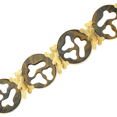 Lot 973 - Gold and Carved Tiger's Eye Bracelet, Wolfers