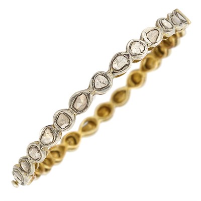 Lot 453 - Indian Gold, Silver and Foiled-Back Diamond Bangle Bracelet