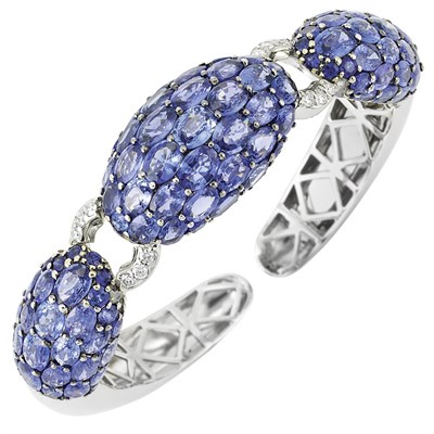 Lot 121 - White Gold, Sapphire and Diamond Bangle Bracelet