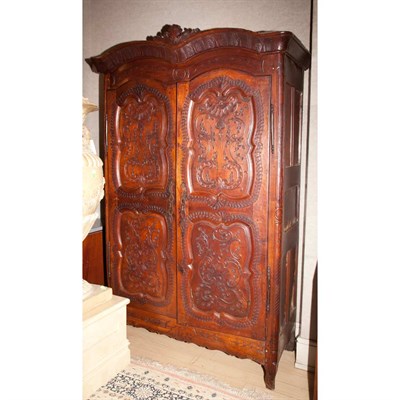 Lot 317 - Louis XV Pine Armoire The molded arched crown...