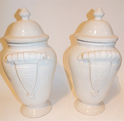 Lot 551 - Pair of Continental White Glazed Earthenware...