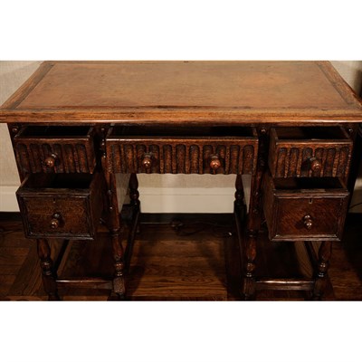 Lot 450 - English Oak Writing Table The leather inset...