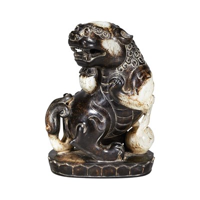 Lot 283 - Chinese Black and White Jade Lion Seated on a...
