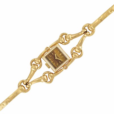 Lot 22 - Lady's Gold, Tiger's Eye and Diamond Bracelet-Watch, Gucci
