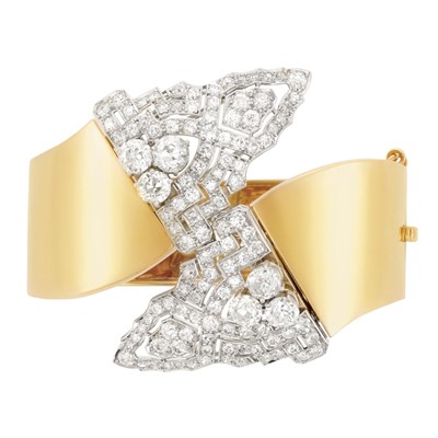 Lot 203 - Gold, Platinum and Diamond Double Clip Bangle Bracelet and Gold and Ruby Clip-Brooch, Trabert & Hoeffer, Mauboussin