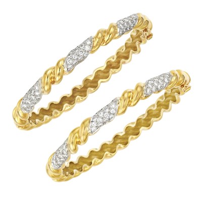 Lot 126 - Pair of Two-Color Gold and Diamond Bangle Bracelets