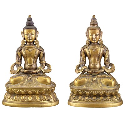 Lot 36 - Two Similar Sino-Tibetan Gilt-Bronze Seated...