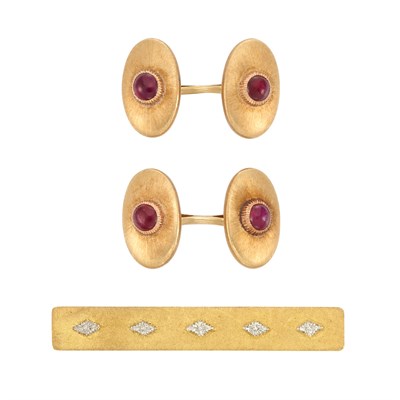 Lot 146 - Pair of Gold and Cabochon Ruby Cufflinks and Tie Bar, Mario Buccellati